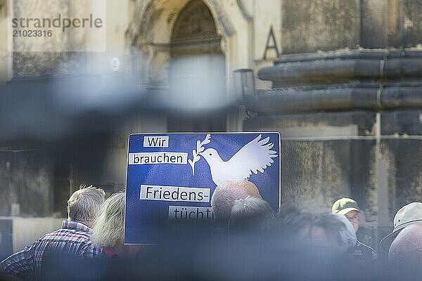 Election campaign event of the Sahra Wagenknecht BSW alliance  on Dresden's Schlossplatz. Supporters with peace poster  State election campaign in Saxony  Dresden  Saxony  Germany  Europe