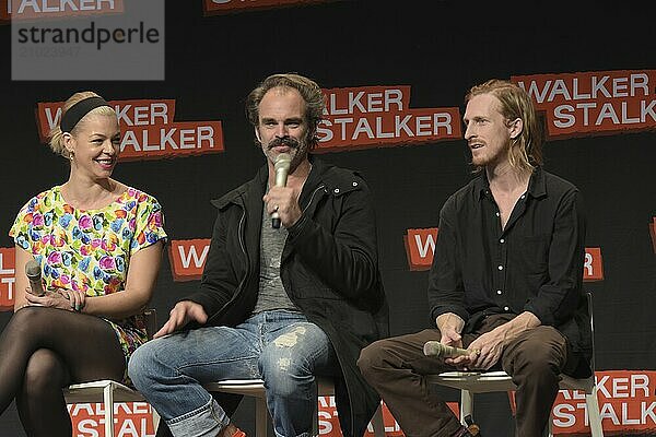 MANNHEIM  GERMANY  MARCH 17: (L to R) Actors Pollyanna McIntosh  Steven Ogg  Austin Amelio (The Walking Dead)  panel  at Walker Stalker Germany convention. (Photo by Markus Wissmann)