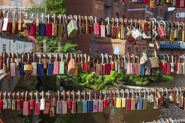 Colourful love locks on the Brause Bridge  Lüneburg  Lower Saxony  Germany  Europe