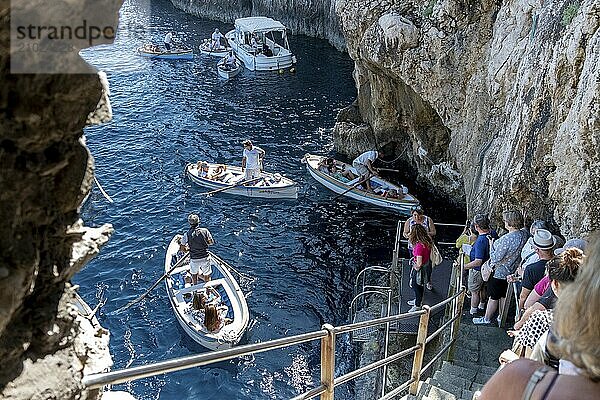 Italy  Gulf of Naples. Capri  Blue Grotto. Waiting boats in front of the cave entrance  Capri  Campania  Italy  Europe