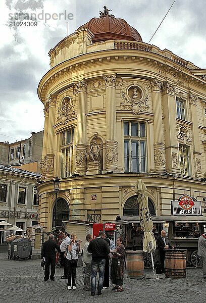 Bucharest  city centre  building in the old town and in front of it a sausage stand  Romania  Europe