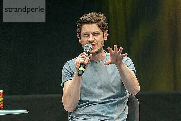 STUTTGART  GERMANY  JUN 29th 2019: Iwan Rheon (*1985  Welsh actor  singer and musician) talks about his experiences in the movie industry at Comic Con Germany Stuttgart  a two day fan convention