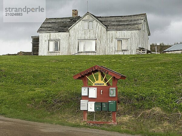 Derelict house on the shore of the Arctic Ocean  beside the town of Nesseby  May  Varangerfjord  Finnmark  Norway  Europe