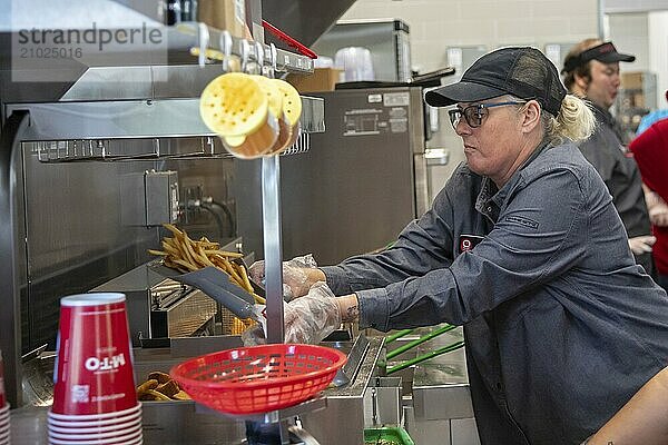 Romulus  Michigan USA  27 August 2024  Workers filled fast food orders as Sheetz opened its first Michigan gas station and convenience store. The family-owned company operates more than 700 stores  mostly in eastern states