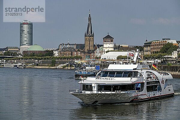 Shipping traffic on the Rhine near Düsseldorf  in front of the old town bank  KD excursion boat Rhein Poesie and tanker Eiltank 65  North Rhine-Westphalia  Germany  Europe