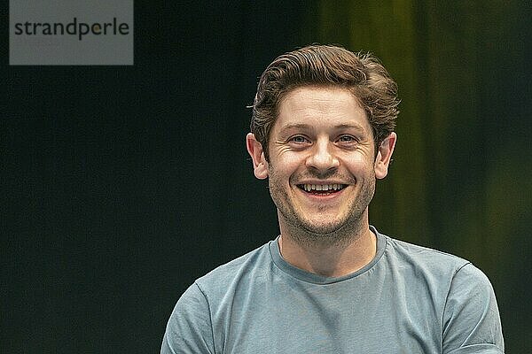 STUTTGART  GERMANY  JUN 29th 2019: Iwan Rheon (*1985  Welsh actor  singer and musician) talks about his experiences in the movie industry at Comic Con Germany Stuttgart  a two day fan convention