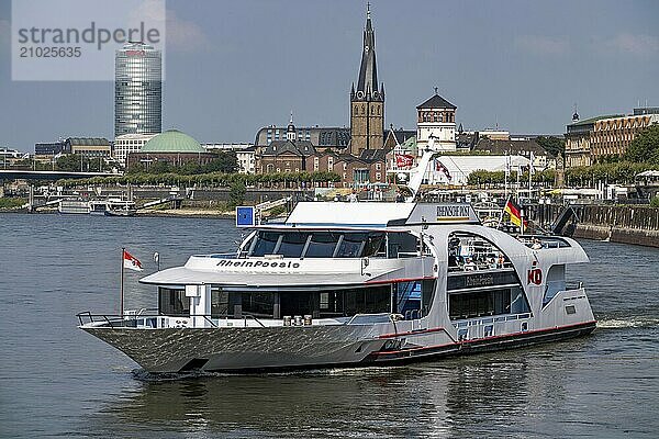 Shipping traffic on the Rhine near Düsseldorf  in front of the old town bank  KD excursion boat Rhein Poesie  North Rhine-Westphalia  Germany  Europe