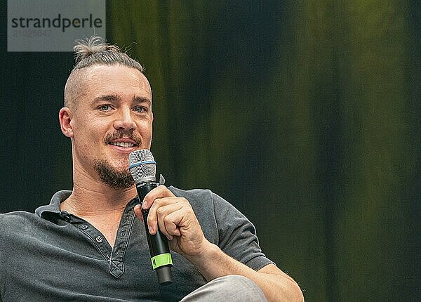 STUTTGART  GERMANY  JUN 29th 2019: Alexander Dreymon (*1983  German actor and film actor) talks about his experiences in the movie industry at Comic Con Germany Stuttgart  a two day fan convention