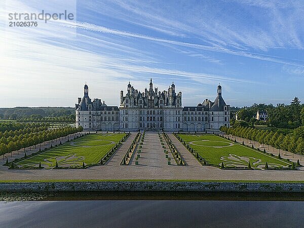 An imposing castle with impressive gardens and symmetrical gravel paths under a clear blue sky  aerial view  Chambord Castle  Château de Chambord  Loire Castle  Loire Valley  Loir-et-Cher Department  Centre Region  France  Europe