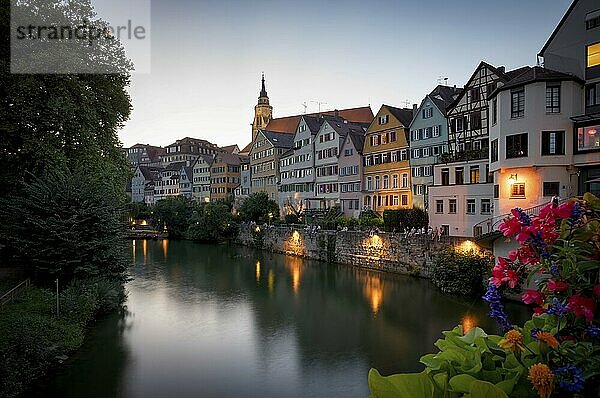 View in summer from the Neckar bridge onto the Neckar front with historic buildings  collegiate church and Hölderlin tower  evening  twilight  atmospheric  blue hour  Tübingen  Baden-Württemberg  Germany  Europe