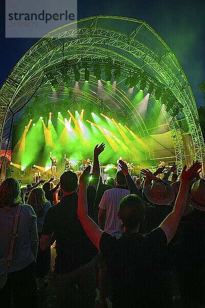 At night at the open-air concert with green lighting  crowd and stage  Klostersommer  Calw Hirsau  Black Forest  Germany  Europe