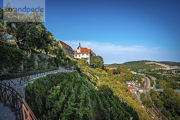 A path along a hill flanked by the old castle of the Dornburg castles and a sweeping view over the valley under a clear sky  Dornburg-Camburg  Thuringia  Germany  Europe