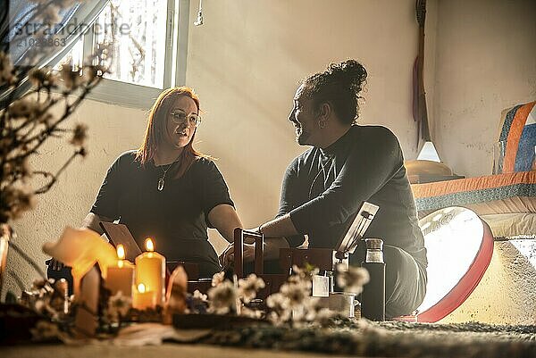 Shamans preparing and talking to each other for the cocoa ceremony. A moment of connection and spiritual preparation before the sacred ritual