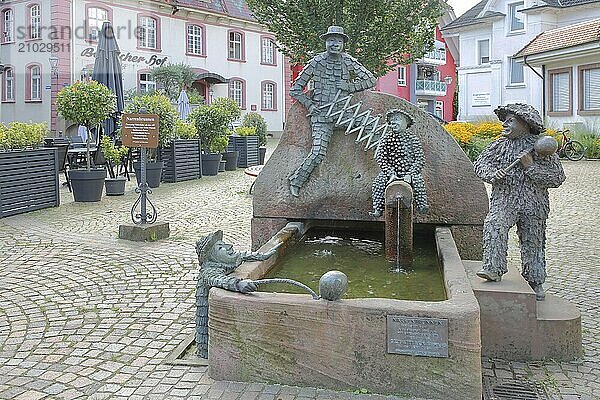 Fool's fountain by Walter Haaf 1971  carnival fountain  Swabian-Alemannic  carnival  four fools  playing card fool  sculptures  bronze  carnival  Zell am Harmersbach  Ortenau  Southern Black Forest  Black Forest  Baden-Württemberg  Germany  Europe