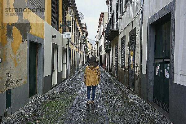 Girl Woman Traveler on a traditional street in Funchal  Madeira