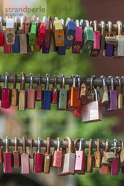 Colourful love locks on the Brause Bridge  Lüneburg  Lower Saxony  Germany  Europe