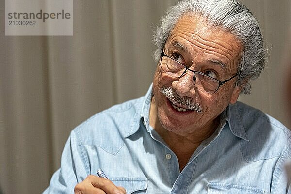 BONN  GERMANY  MAY 19th 2018: Edward James Olmos (*1947  american actor  Battlestar Galactica  Miami Vice) signing autographs for fans at Fedcon 27  a four day sci-fi fan convention