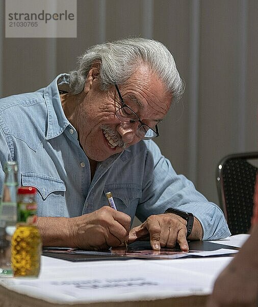 BONN  GERMANY  MAY 19th 2018: Edward James Olmos (*1947  american actor  Battlestar Galactica  Miami Vice) signing autographs for fans at Fedcon 27  a four day sci-fi fan convention