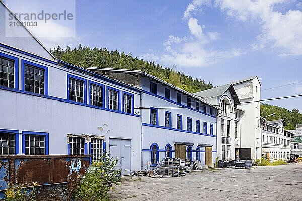 Schindler's blue colour factory is located directly on the Zwickauer Mulde river and belongs to the Zschorlau district of Albernau in the Saxon Ore Mountains. Since 2019  it has been part of the Schneeberg Mining Landscape and a UNESCO World Heritage Site in the Erzgebirge/Krušnohorí Mining Region. On 27 February 1649  the Schneeberg merchant Erasmus Schindler bought a plot of land to build a blue paint factory on the Zwickauer Mulde near Albernau. On 4 May 1649  he received the privilege to build a blue dye mill from Elector Johann Georg I. As Schindlerswerk GmbH & Co. KG  it is probably the world's oldest paint factory still in production. It is associated with a long tradition of producing blue cobalt pigments and the commercial manufacture of colour pigments. In more recent times  production has been expanded to include various paints. Laundry blue is also produced. Dry mill with drum packing plant and mechanical workshop  Schindlerswerk  Zschorlau OT Albernau  Saxony  Germany  Europe