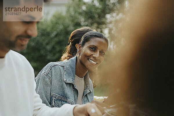 Portrait of smiling mature woman at family gathering