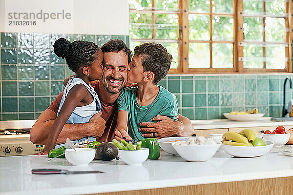 Children (6-7  8-9) kissing in kitchen