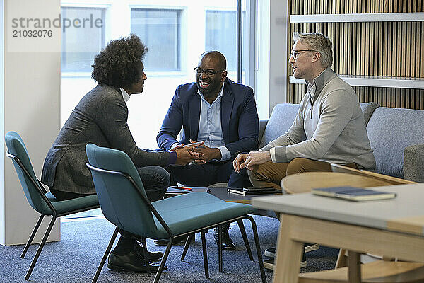 Businessmen talking in office