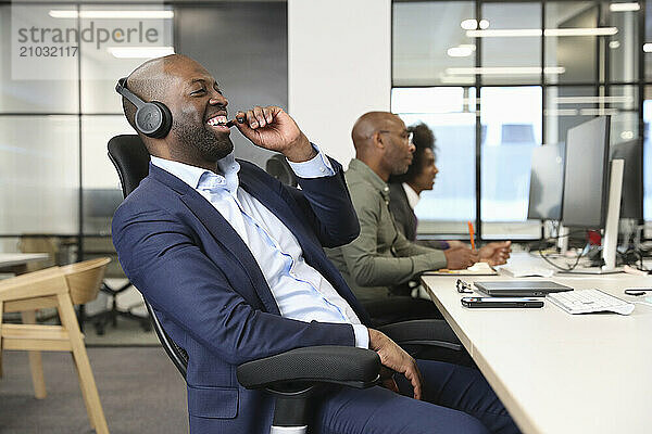 Businessman with headset in office