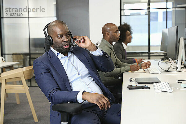 Businessman with headset in office