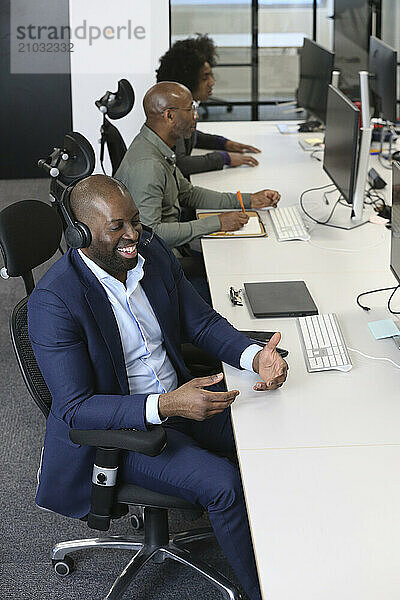 Businessman with headset in office