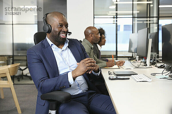 Businessman with headset in office