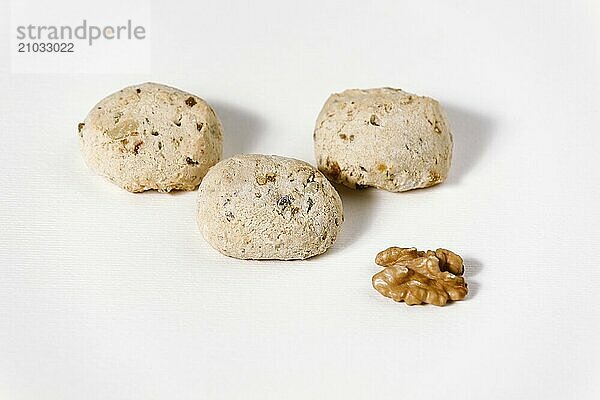 Cavallucci  typical Italian cookies with walnut on white background