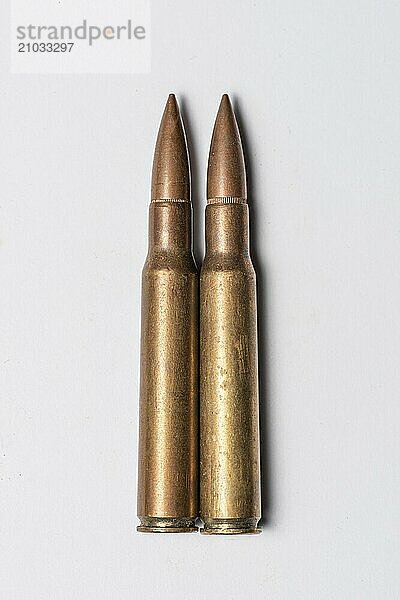 Two rifle bullets on white background