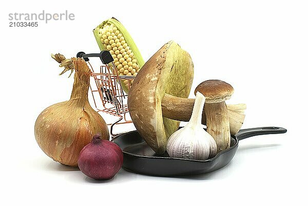 Seasoning still life with Boletus mushroom  garlic and fresh onions isolated on a white background