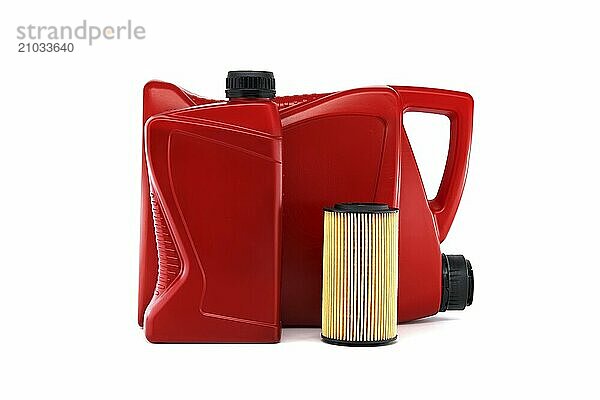 Red canister of motor oil and a filter isolated on white background  car servicing  automotive industry  oil and filter replacing maintenance