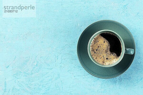 Coffee cup  shot from the top on a blue background with a place for text  espresso drink  Food photography  Food photography