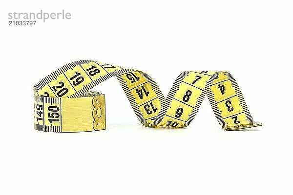 Spirals of yellow tape measure create a visual impression of motion  isolated white background