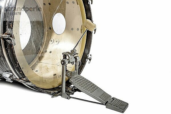 Large bass drum with beater and foot pedal on a white background