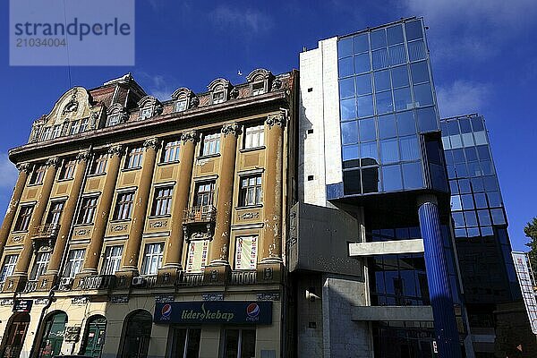 Houses  old building and modern building with glass facade  Romania  Banat  Timisoara  Timisoara  Europe