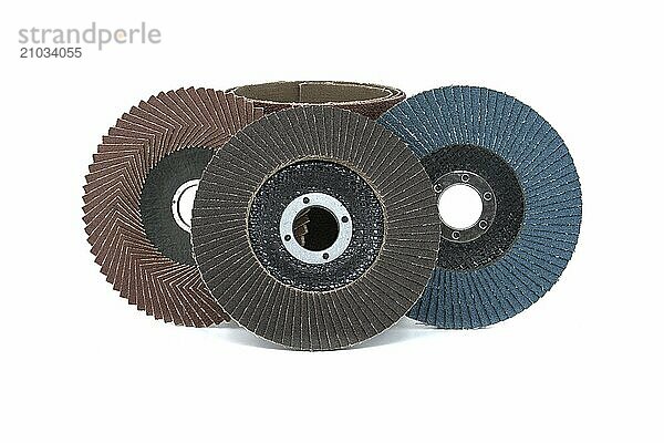 Sanding discs and sandpaper in close-up view isolated on white background  typically used for grinding  sanding  and polishing in various industries