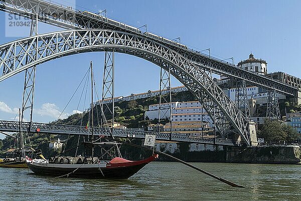 Place of interest  architecture  view from the promenade to Vila Nova de Gaia  Rabelos on the Douro river and the bridge Ponte Dom Luis I  Porto  Portugal  Europe