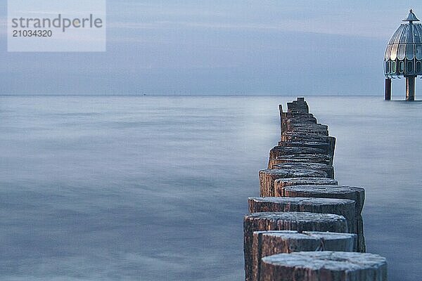 Groynes jutting into the sea. taken in zingst on the darss. the perspective is directed to the horizon