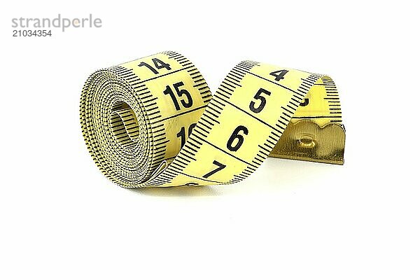 Spirals of yellow tape measure create a visual impression of motion  isolated white background