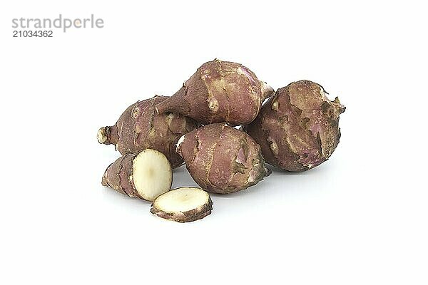 Sunchokes tubers isolated on white background. Jerusalem artichokes (Helianthus tuberosus)  wild sunflower or topinambur