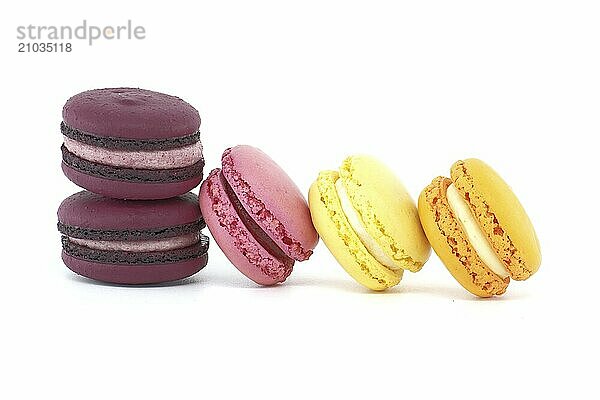 Vibrant assortment of sweet meringue based macaroons isolated on white background. Full depth of field