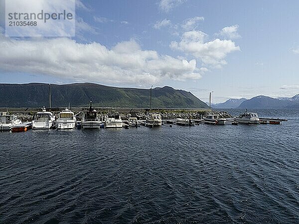 Motorboats moored in the harbour of Brandal in Norway