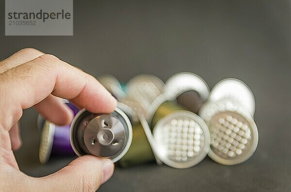 Colorful espresso coffee capsules used on black background  recycling  environment