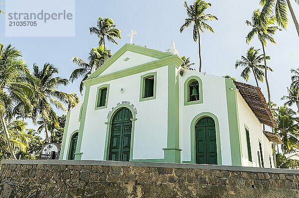 Beautiful view of (Capela de São Benedito) Chapel of St. Benedict and Carneiros Beach (Praia dos Carneiros)  Pernambuco  Brazil. Secular Chapel of Carneiros Beach. Church in the beach with palm trees