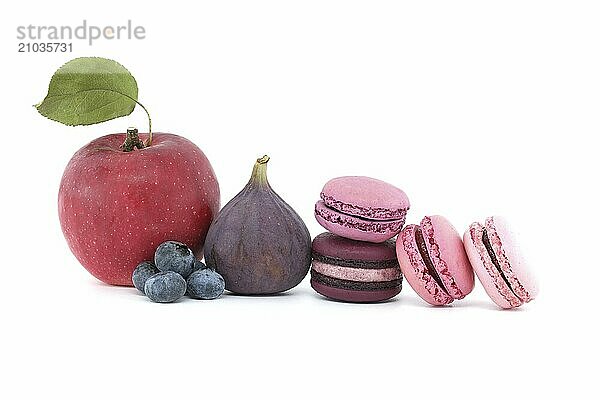 Array of macaroons and fruits isolated on white background. Full depth of field