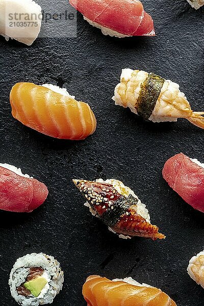 Sushi. Nigiri with eel  tuna  shrimp on a black background  Japanese food on a plate at an Asian restaurant  Food photography  Food photography