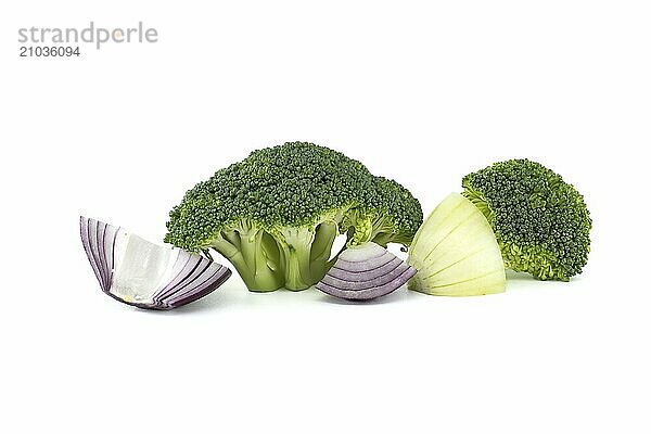 Fresh raw green broccoli near slices yellow and red onions isolated on white background